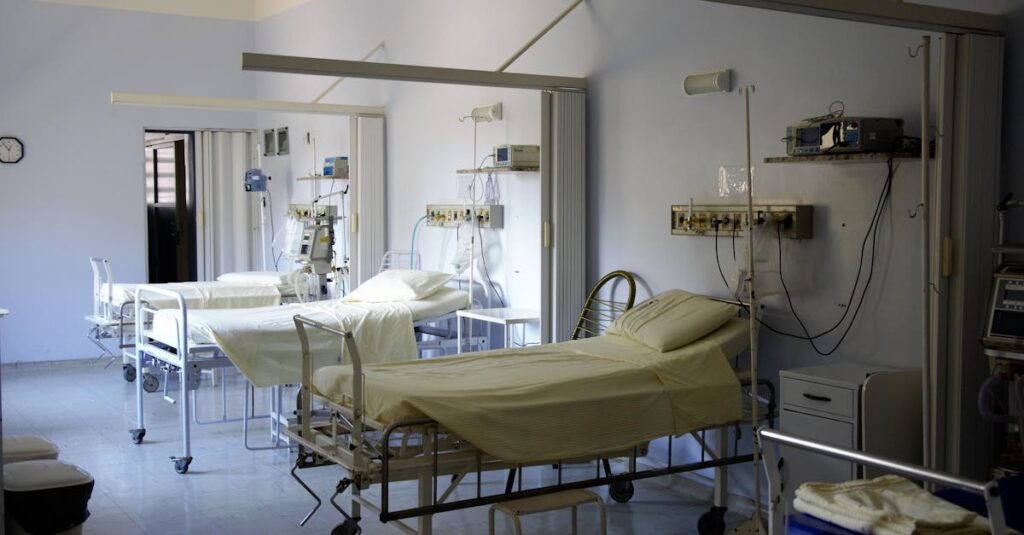 pexels-photo-236380-236380 Spacious hospital room with several empty beds and medical equipment, emphasizing healthcare and hygiene.
