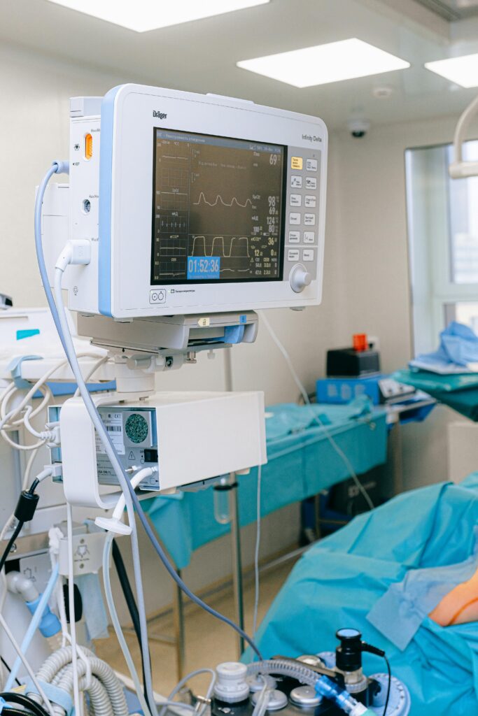 pexels-photo-3844581-3844581 Close-up of vital signs monitor in a modern operating room setup.